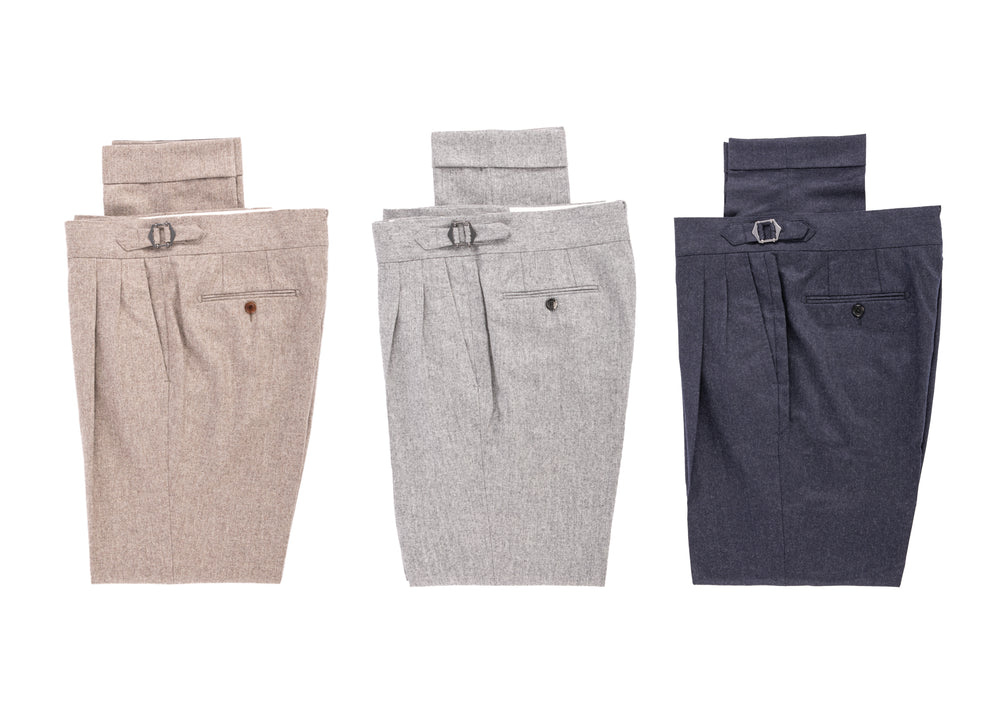 Showcasing three different trousers in brown, gray and navy blue